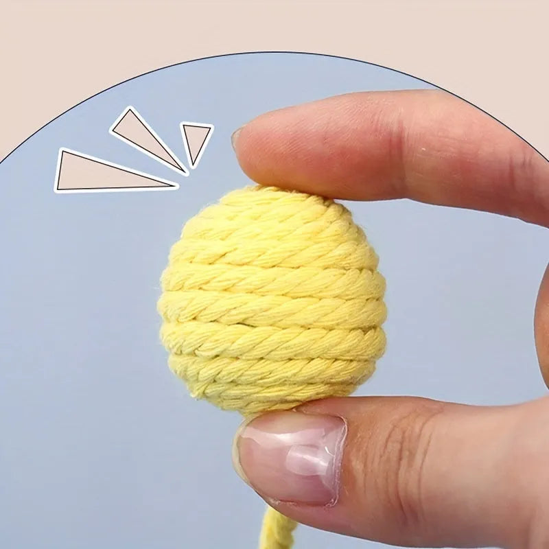 Colourful cat toy ball with attached rope, internal bell makes sound when rolled