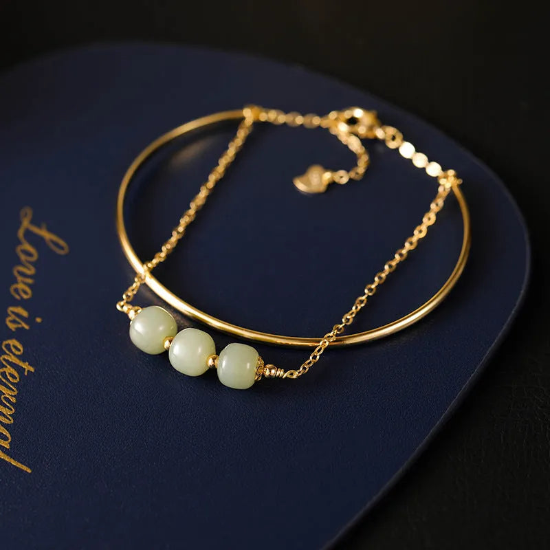 Women's Hetian jade lucky beads bracelet with gold inlay, shown in single, double, and three beads versions.