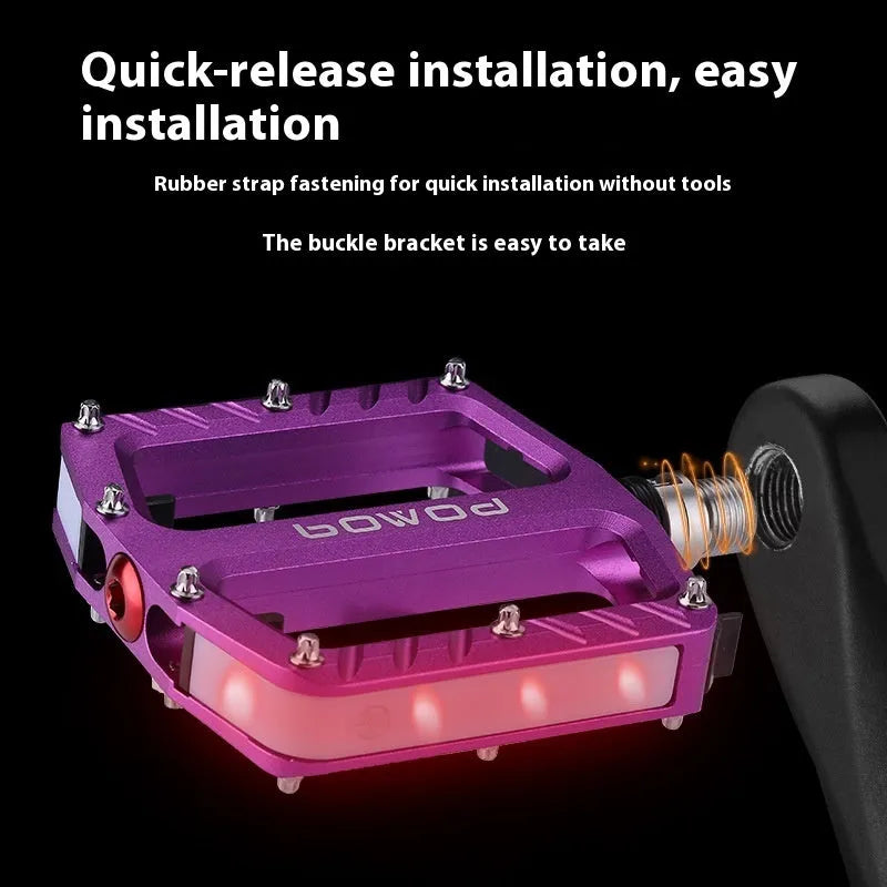 Aluminium alloy bicycle pedals with built-in 710LED lights in black, gold, purple, red, and titanium colour options.