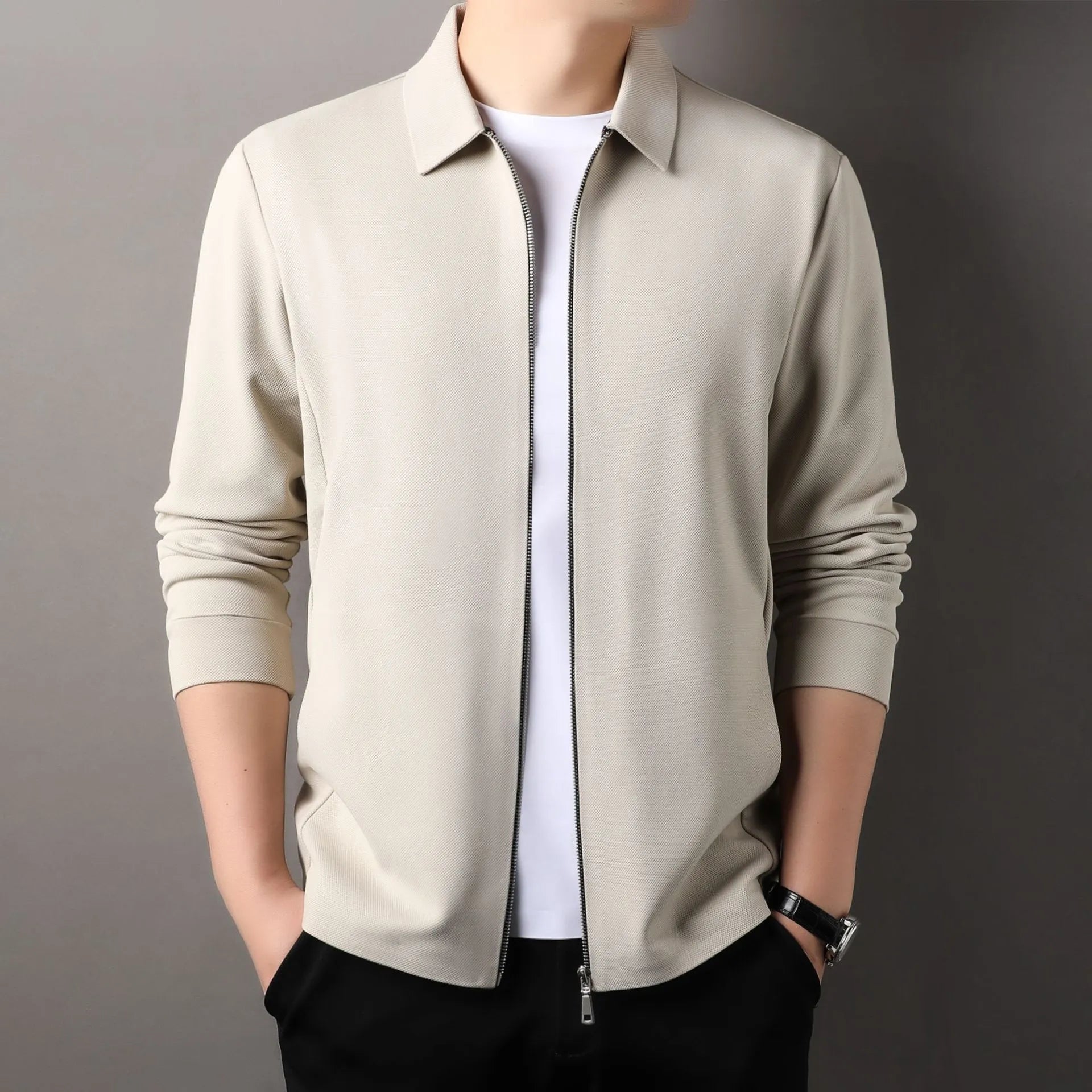 Men's black polyester casual business jacket with long sleeves on a hanger.