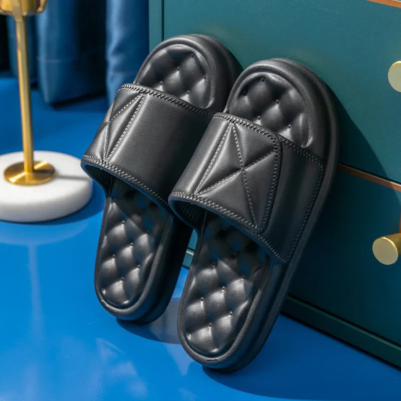 Pair of soft EVA bathroom slippers with a thick non-slip sole, shown in a selection of colours.