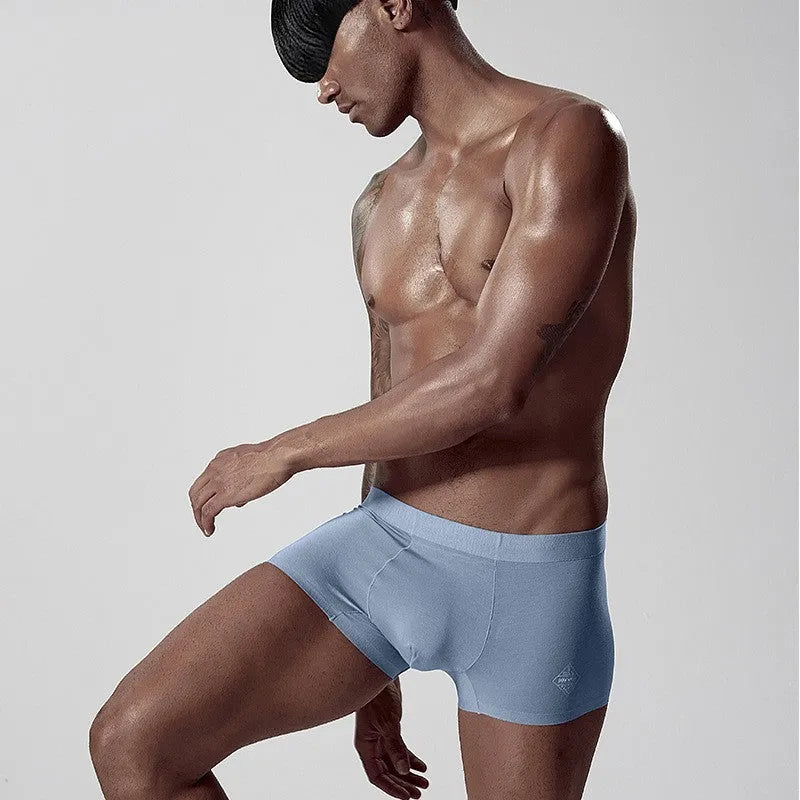 Men's seamless modal underwear in green showing mid-waist design and smooth construction