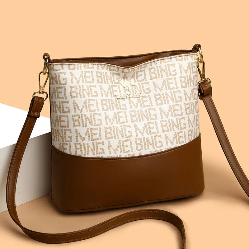 Brown soft leather messenger bag with front pocket and shoulder strap