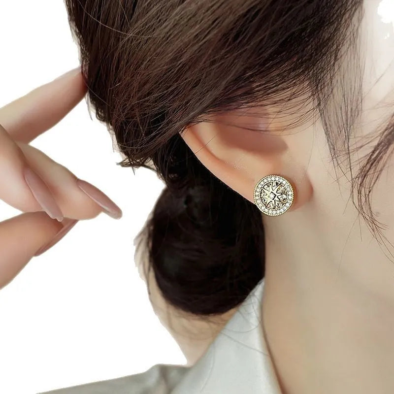 Pair of copper stud earrings with real gold plating and inlaid zircon in an eight-pointed star shape for women