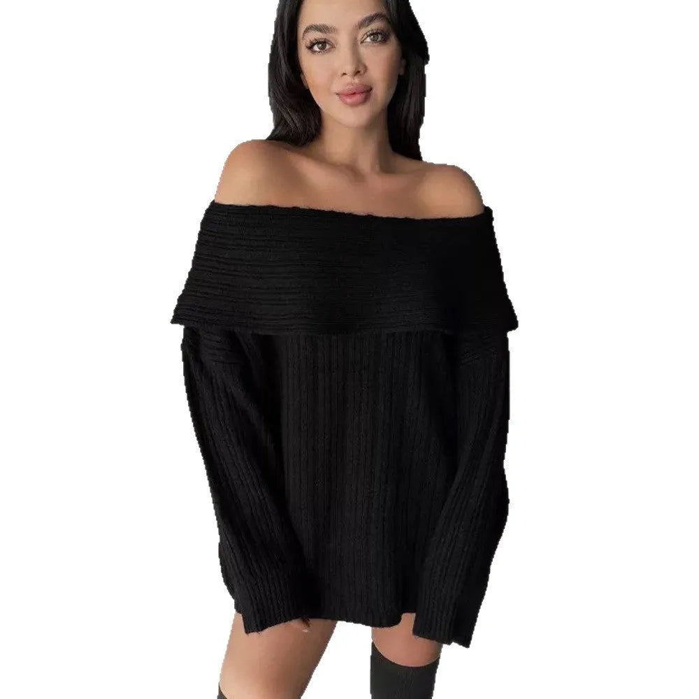 A woman wearing a loose, long-sleeved acrylic pullover sweater in a neutral colour.