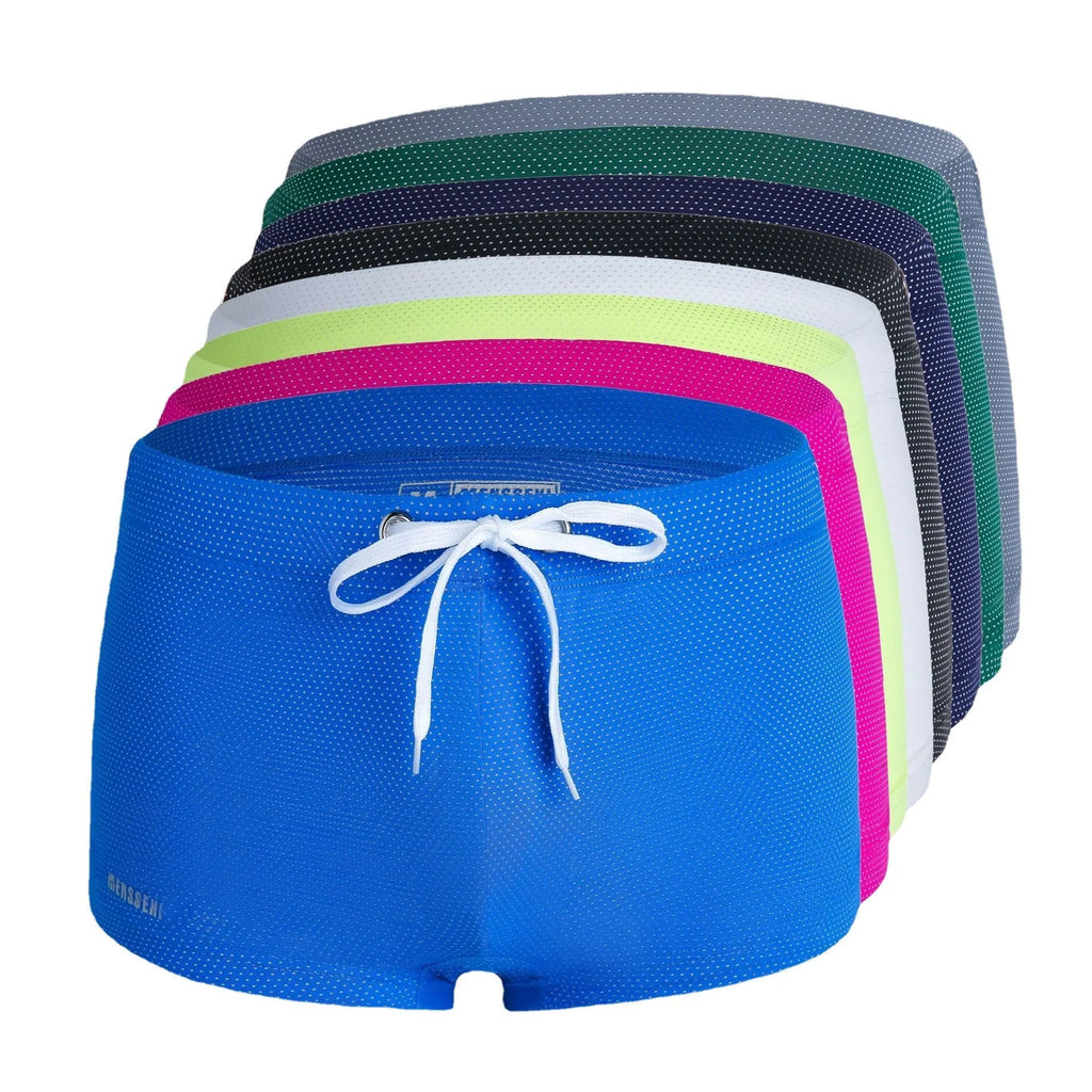 Men's solid colour lace nylon low waist boxer swimming trunks on a white background.