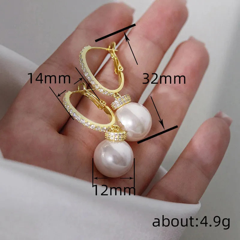 Yellow gold finish earrings with imitation pearls and inlaid zircon on copper base