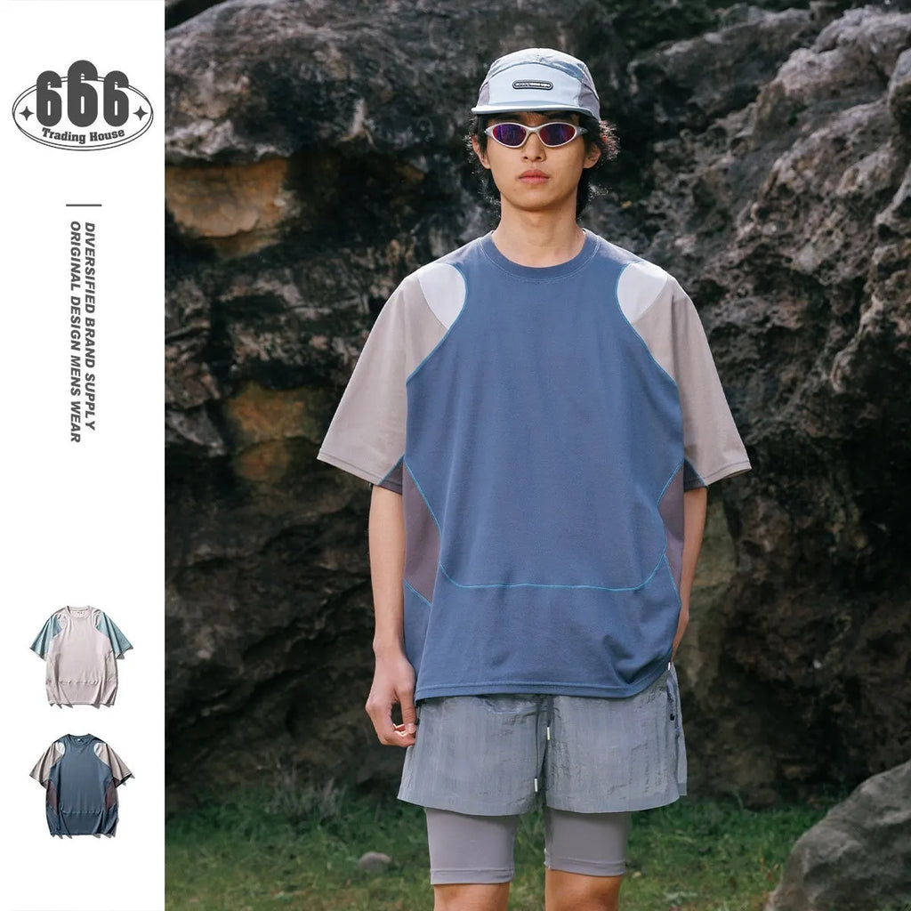 Men's loose blue short sleeve t-shirt with raglan sleeves on a hanger.
