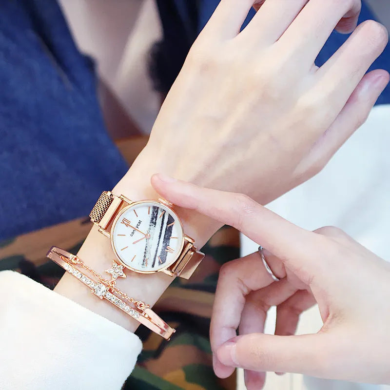 Women's retro marble watch with 32mm round dial, alloy strap, and magnetic buckle on white background