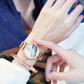 Women's retro marble watch with 32mm round dial, alloy strap, and magnetic buckle on white background