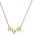 Gold stainless steel three-heart pendant necklace with laser-engraved black text on O-chain