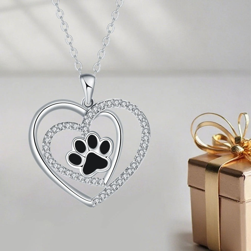 Women's necklace with heart-shaped dog paw pendant on cross chain
