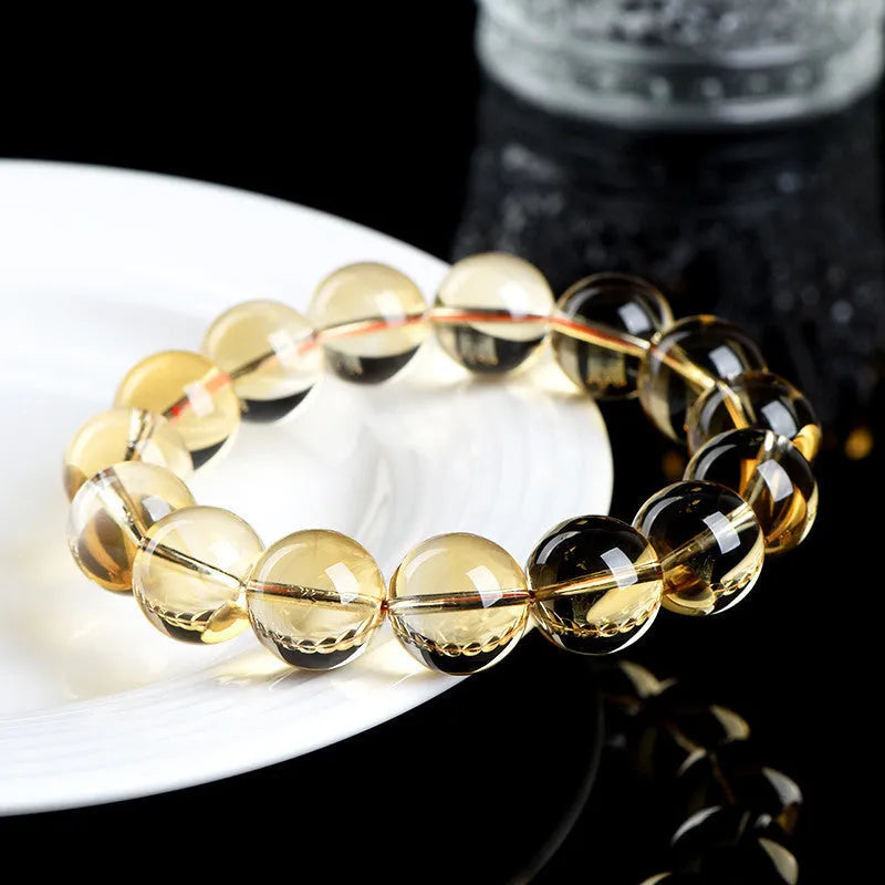 Natural citrine scattered beads ball bracelet showing polished stones and original design on wrist.