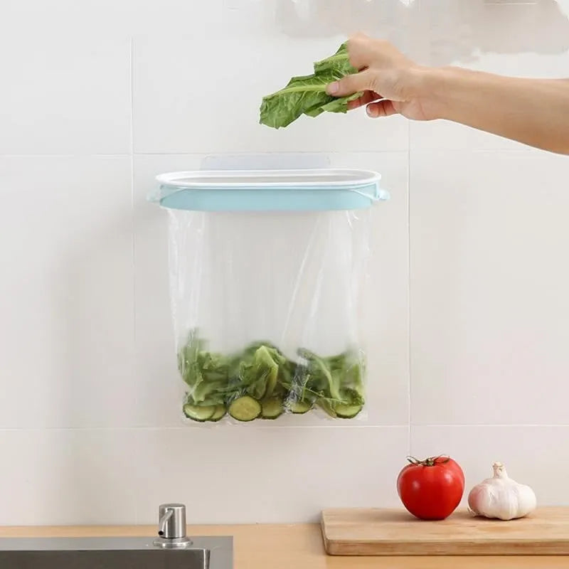 Blue plastic kitchen garbage bag storage rack mounted on cabinet door