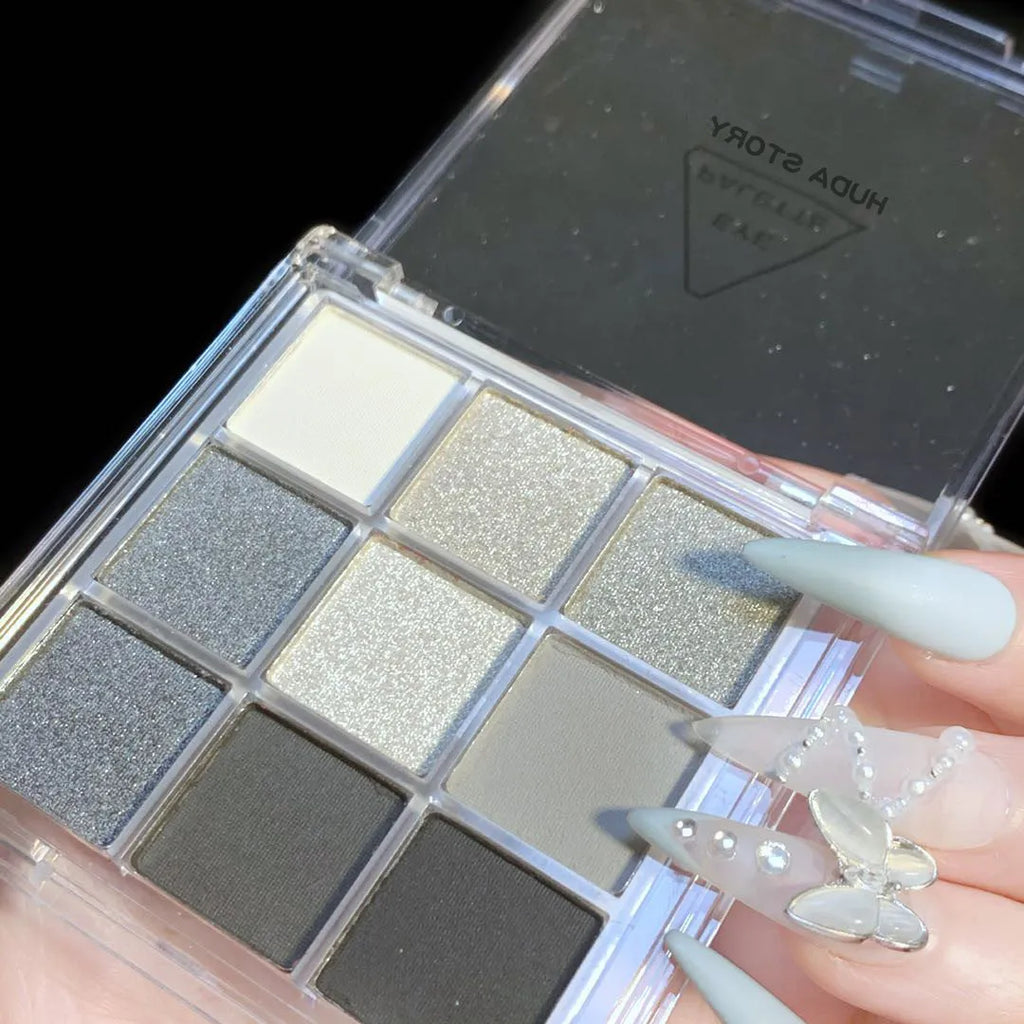 Nine-colour smoked eye shadow palette with white, silver, black, and iron grey shades