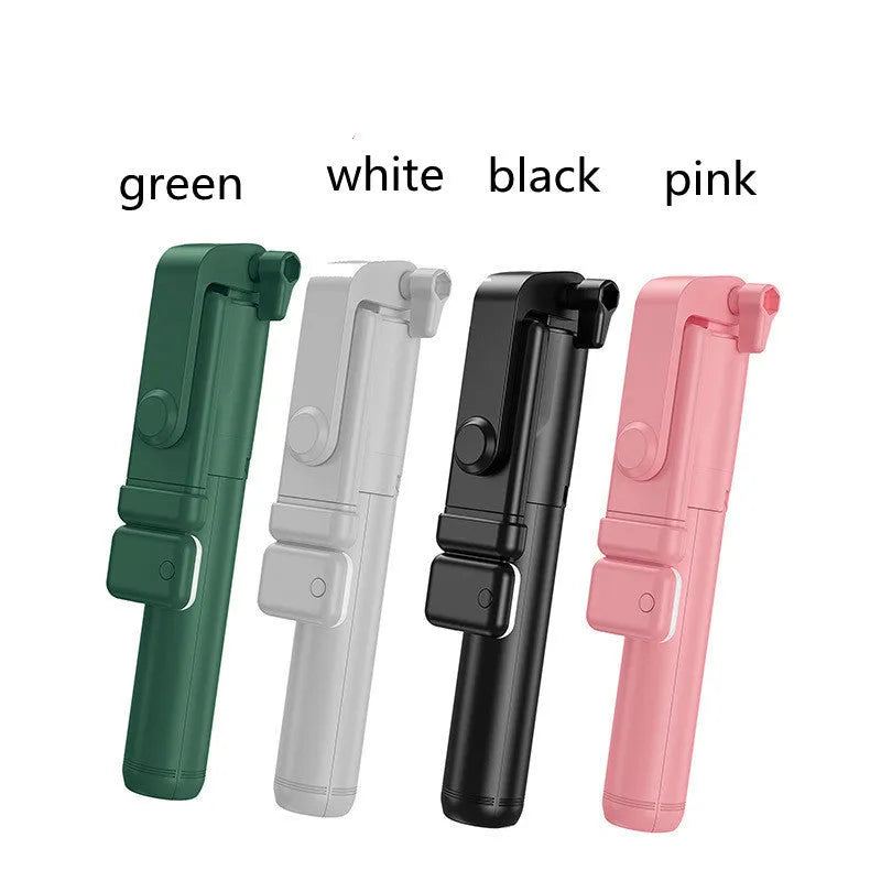 Black Bluetooth selfie stick with extended tripod legs holding an iPhone, showing its 360-degree rotating phone holder.