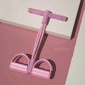Yoga four piece set showing leg stretcher, yoga ring, pedal tension device and figure eight rope