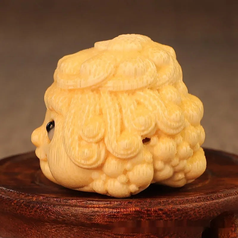 Solid bamboo golden toad princess ornament showing detailed hand carving and natural grain patterns