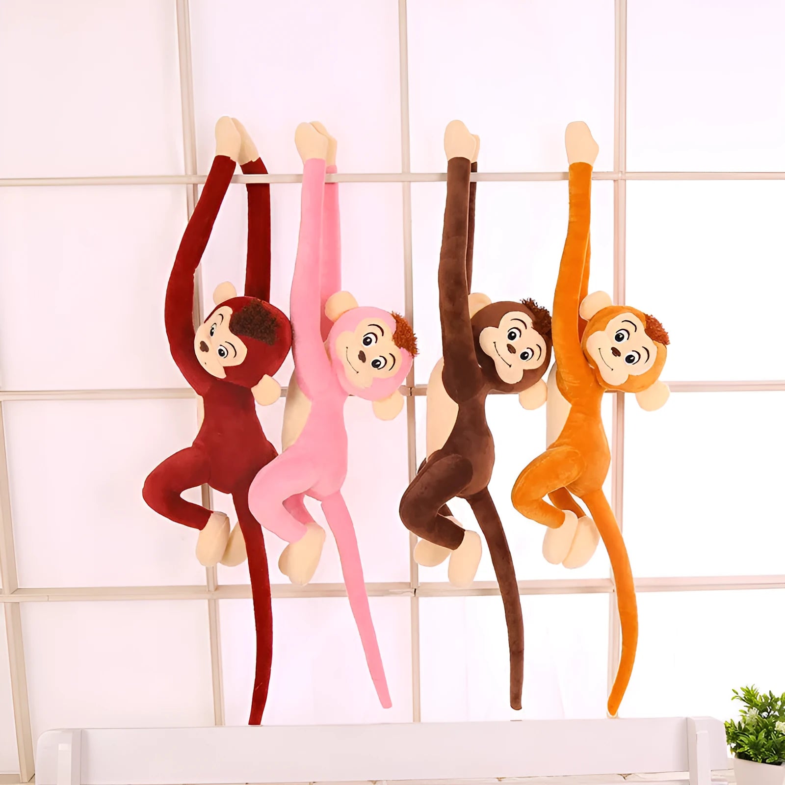 Long arm plush monkey toy hanging as curtain decoration in pink, wine red, dark brown, or light brown