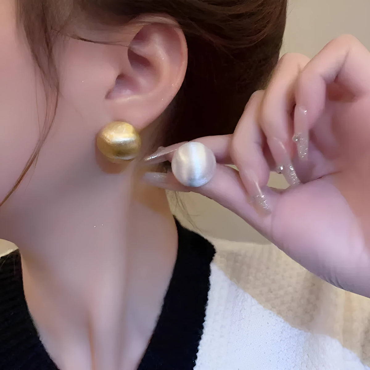 Pair of matte brushed gold bean shaped stud earrings for women with gold and white finish