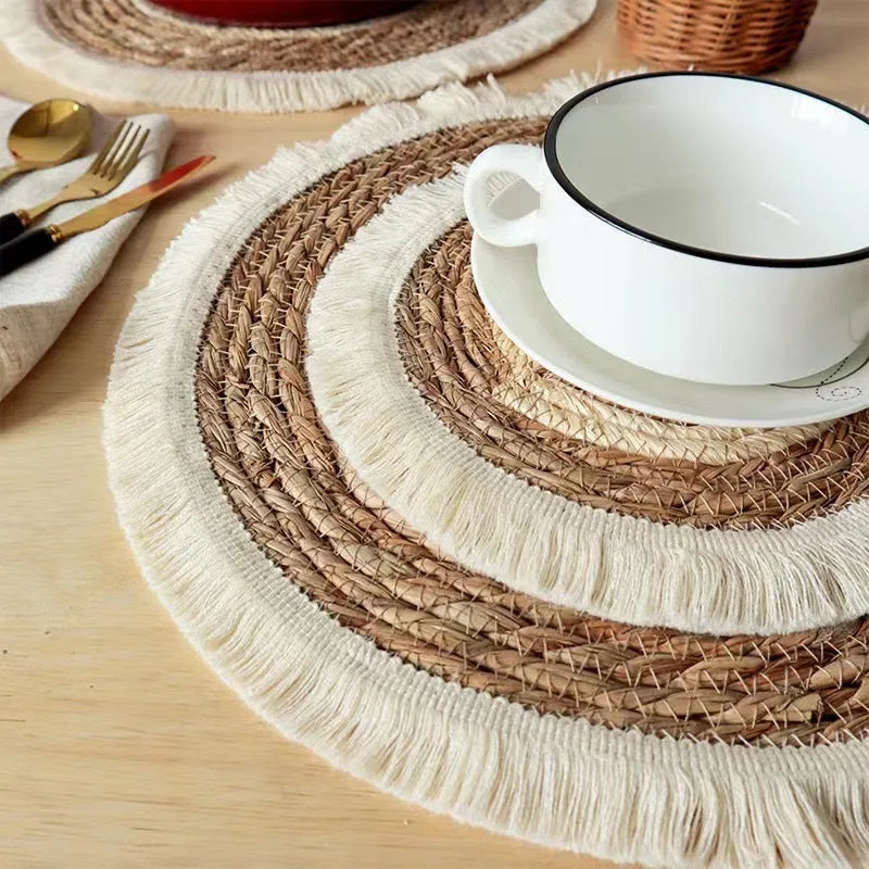 Round Japanese-style papyrus placemat with decorative tassels in natural colour