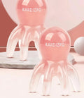 Pink natural resin octopus-shaped facial massage comb for periocular meridian therapy with storage bag.