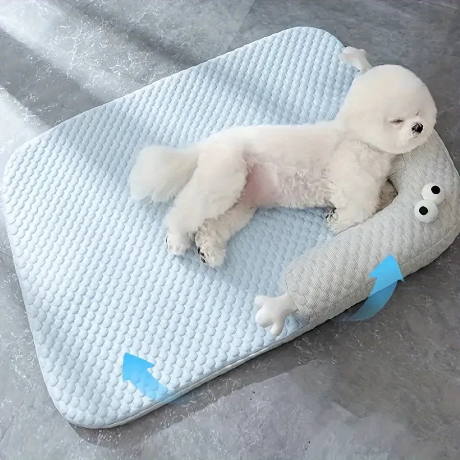Blue big-eyed monster design non-slip pet cushion for dogs and cats on a wooden floor.