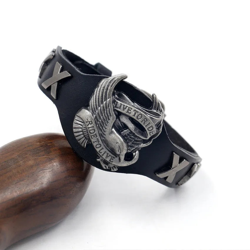Black geometric leather bracelet with an alloy eagle watch-buttom hardware detail.