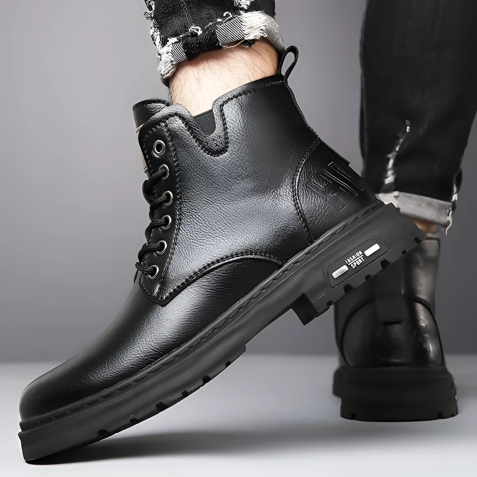 Men's black Martin boots with thick rubber soles and lace-up front, showing round toe and mid-calf design