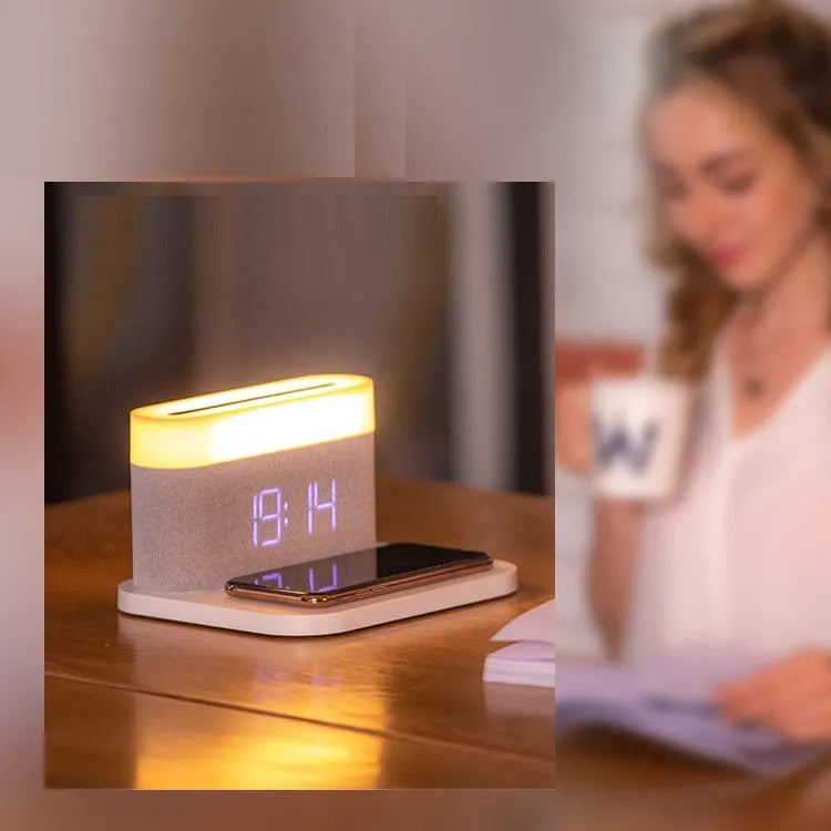 White or black four-in-one bedside lamp with wireless phone charging pad, digital clock display, and LED lighting