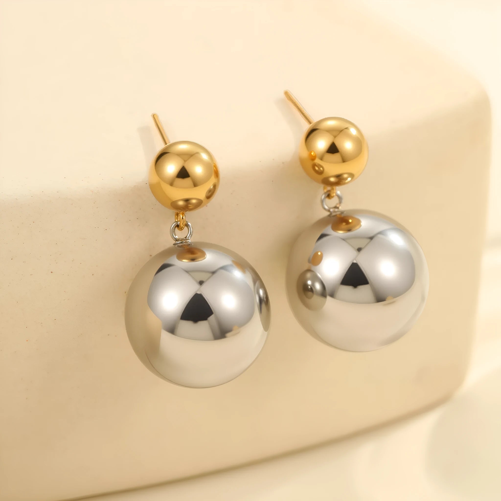 Stainless steel geometric ear studs with round bead design and colour-block electroplating