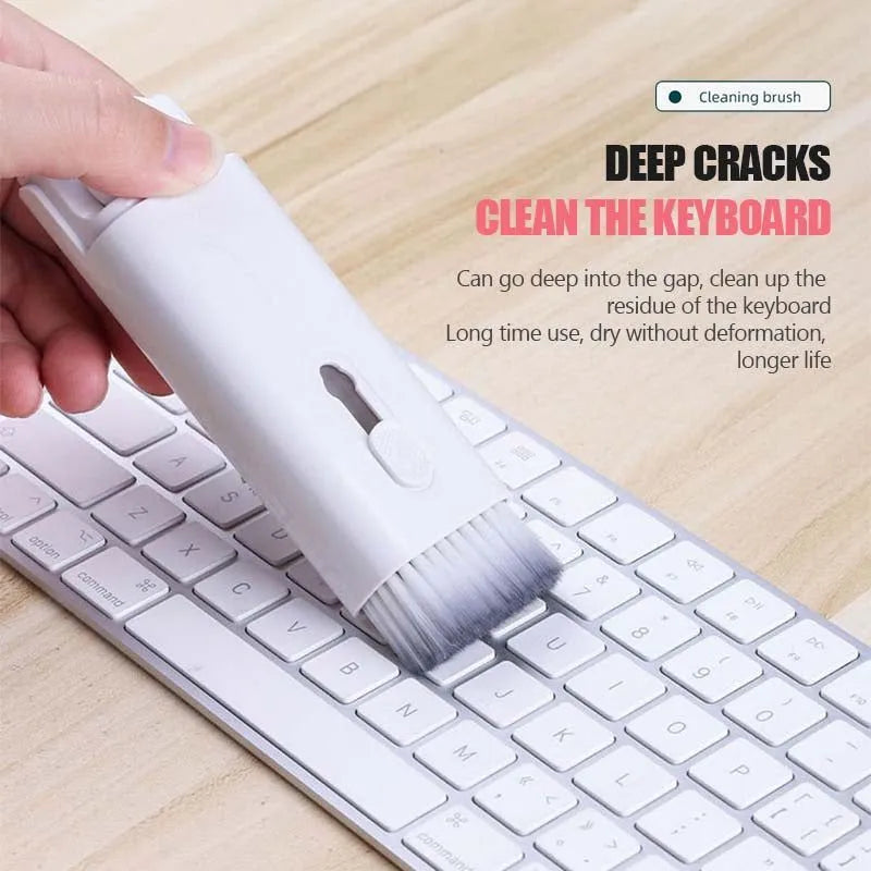 Multifunctional cleaning kit with a double-headed pen, retractable brush, and spray bottle on a white background