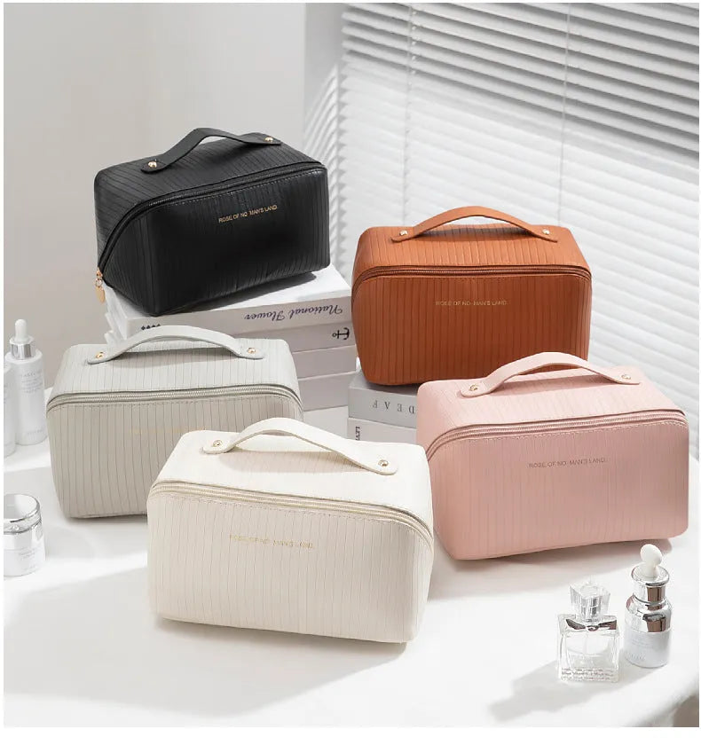 Vertical pattern cubic PU makeup bag in beige, 22.5cm length, for travel cosmetics storage.