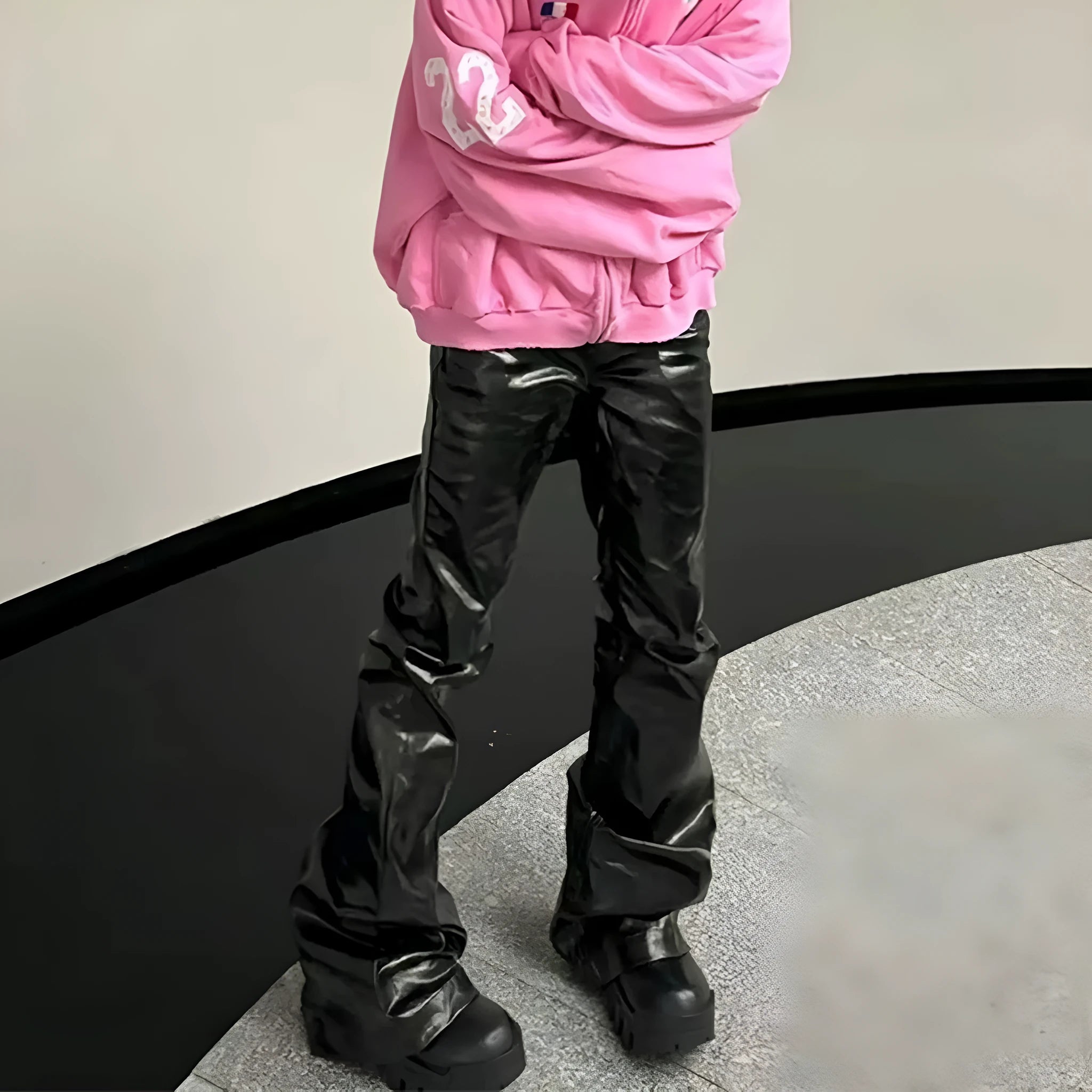Black shiny patent leather coated straight-leg skinny jeans on a model