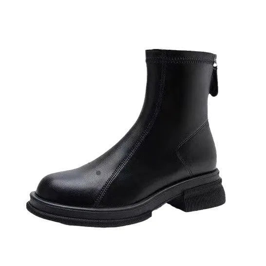 Women's black flat heel ankle boots with round toe and rear zipper on a rubber sole.