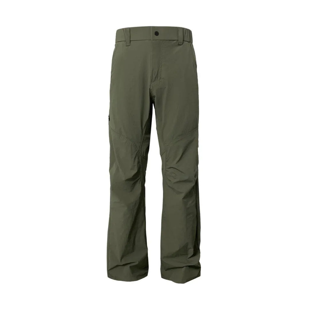 Man wearing grey 3D cut deconstructed casual trousers with a straight leg and elasticated waistband.
