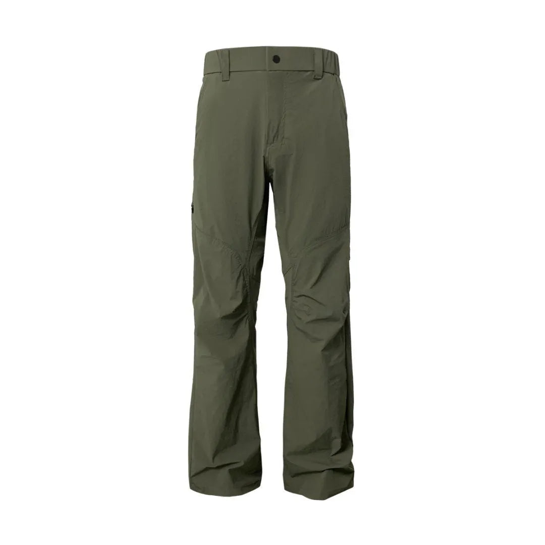 Man wearing grey 3D cut deconstructed casual trousers with a straight leg and elasticated waistband.