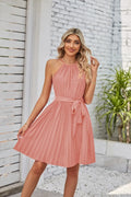 Women's black halter neck strapless dress with a pleated chiffon skirt and adjustable waist belt.