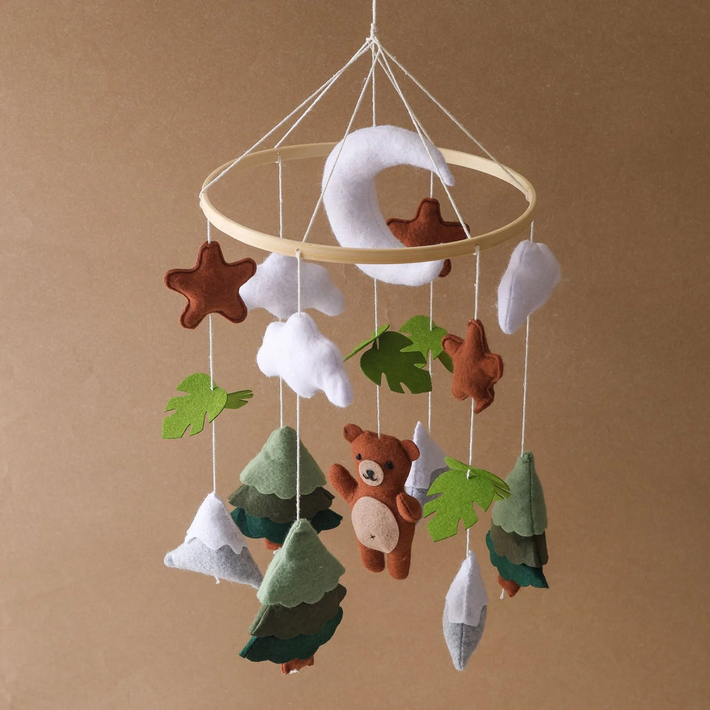 Handmade felt teddy bear bed bell in white on a wooden base for children's soothing sleep
