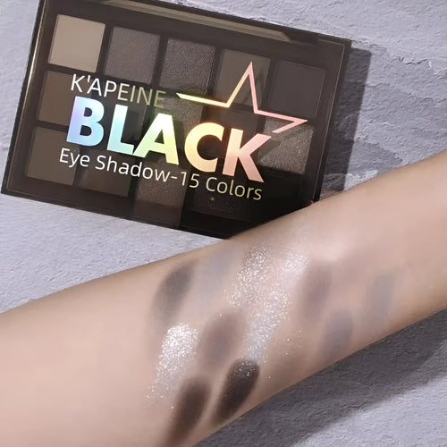 Night Elf 15-colour eye shadow palette open, showing matte and shimmer pans in smoky earth tones.