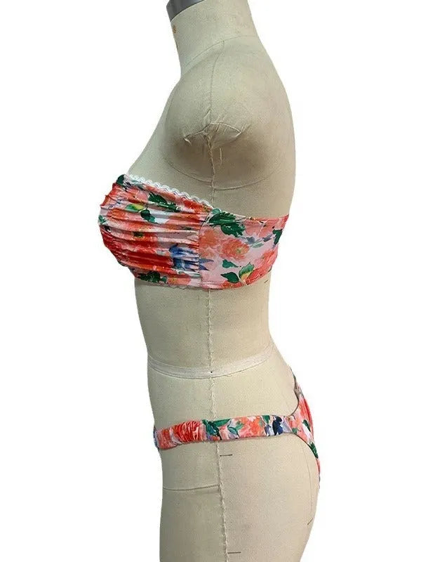 Colourful floral print bikini set with tube top and briefs on a hanger.