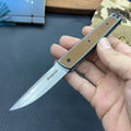Closed and opened views of a black folding fruit knife showing the stainless steel blade and handle.
