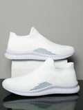 Men's white low-top fabric casual sneakers with round toe and flat sole on a neutral background.