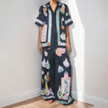 Black women's cardigan and trouser set with cartoon animation pattern