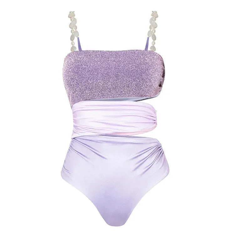 Purple women's one-piece swimsuit with hollow design and matching wrap skirt on mannequin