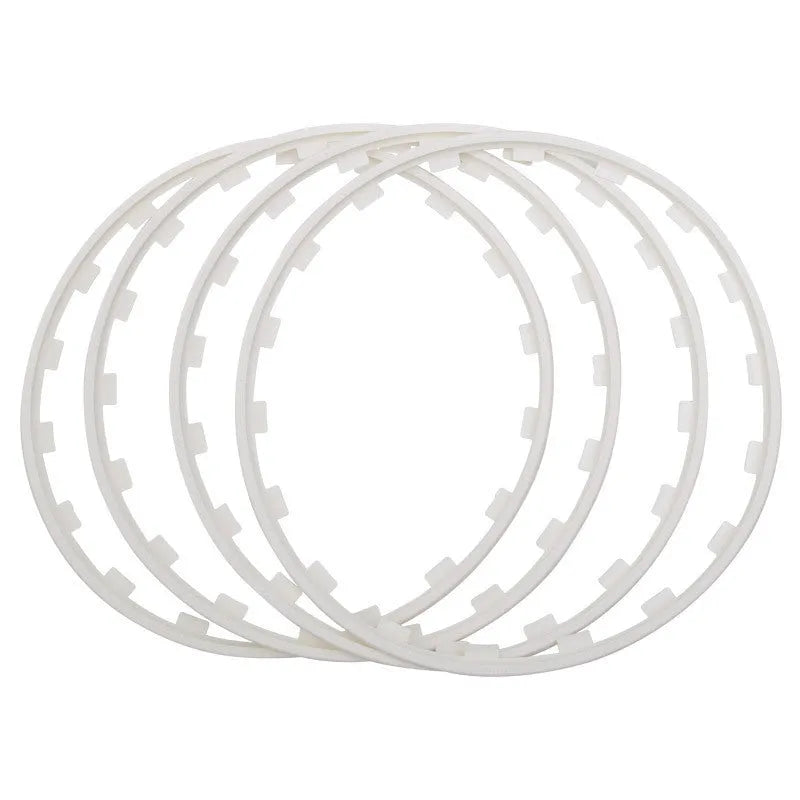 Set of four coloured nylon wheel hub guard rings in sizes 16 to 20 inches.
