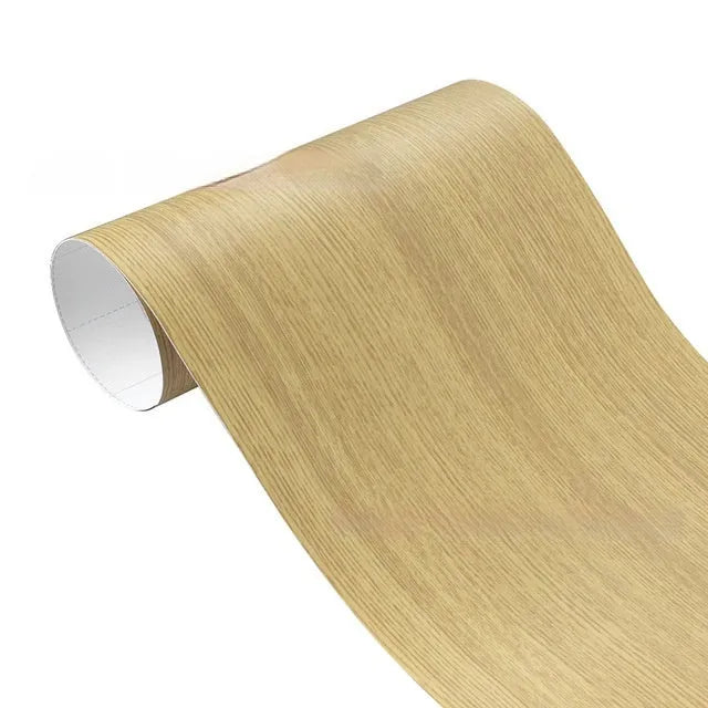 Matte wood grain PVC automotive wrap film roll showing timber pattern texture
