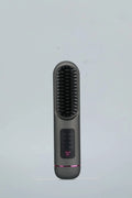 Portable negative ion hair comb in dark blue with USB charging port.