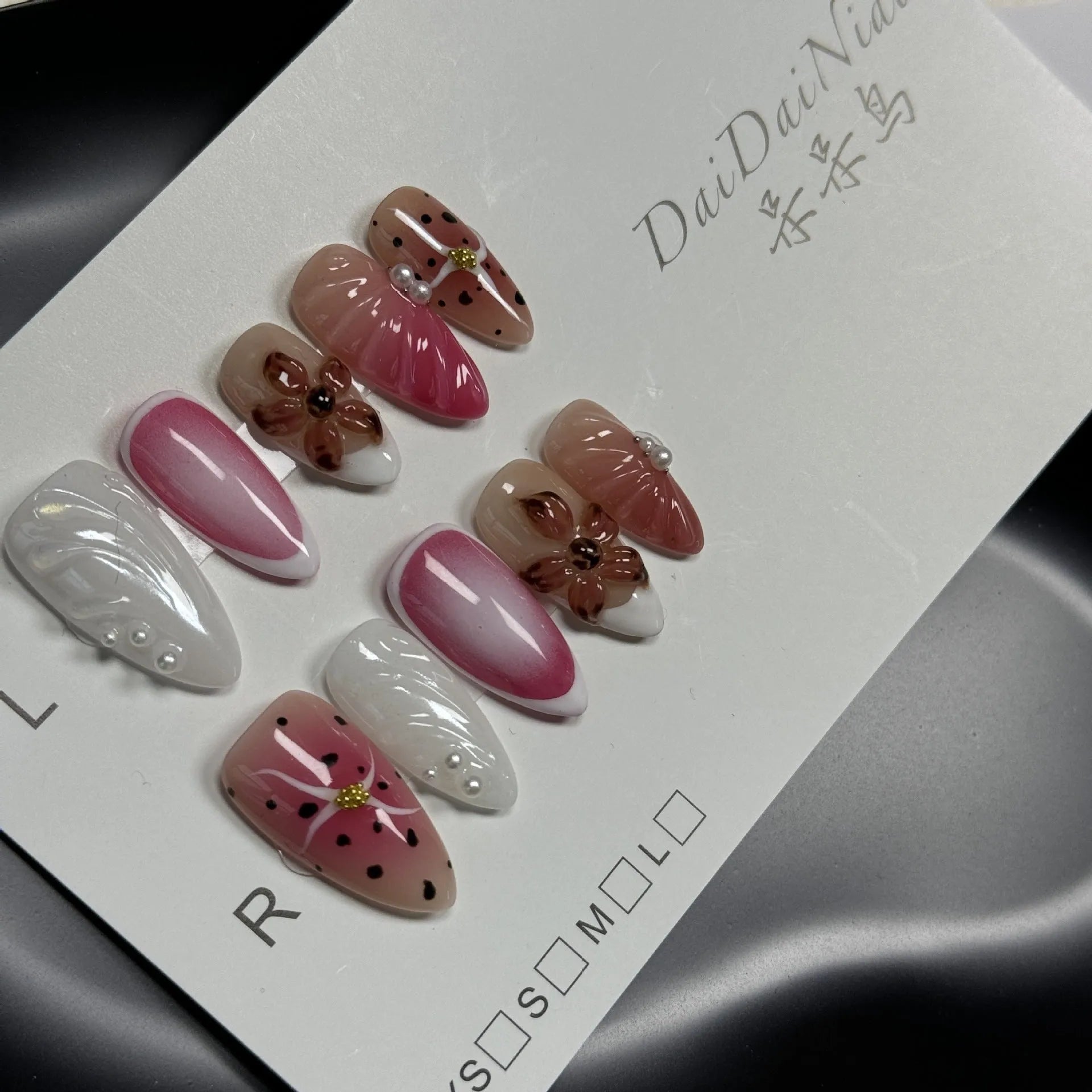 Hand-painted 3D carved nail beauty patches in embossed candy patterns on almond-shaped nails.