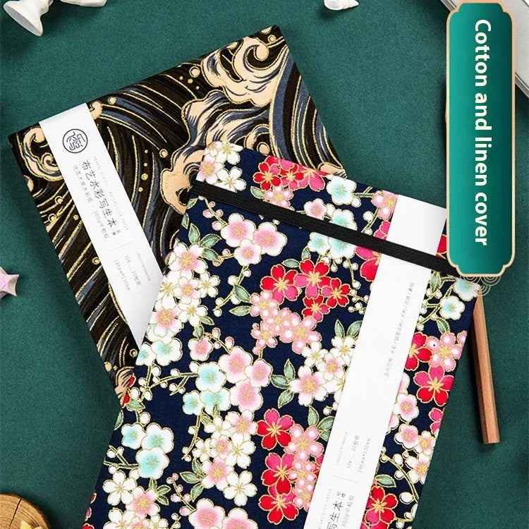 Feiluniao fabric watercolour notebook showing floral and animal cover designs in 185mm length